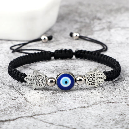 Envy's Gaze: Hamsa Pendant Bracelet