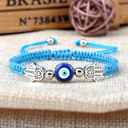 Envy's Gaze: Hamsa Pendant Bracelet