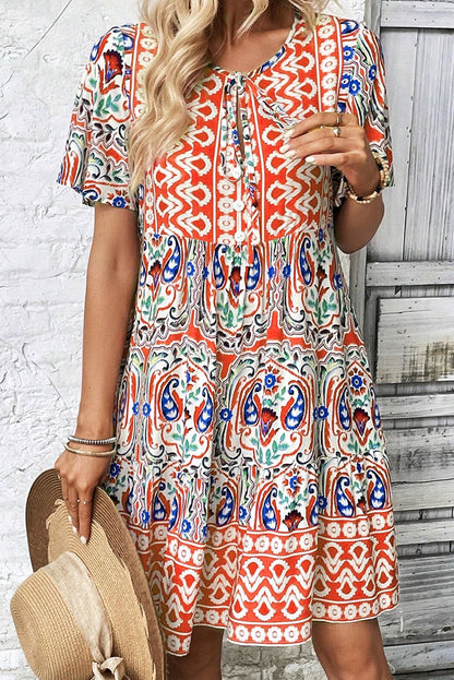 Saffron Breeze: Paisley Accent Tie Neck Ruffle Hem Short Dress